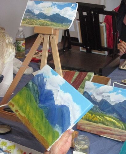 A rebel set aside her Sequoia tree to finish a painting of the Tetons that she began last year.
